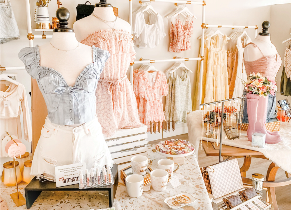 An interior shot of Four Sisters in Omaha, including clothing and accessories for sale