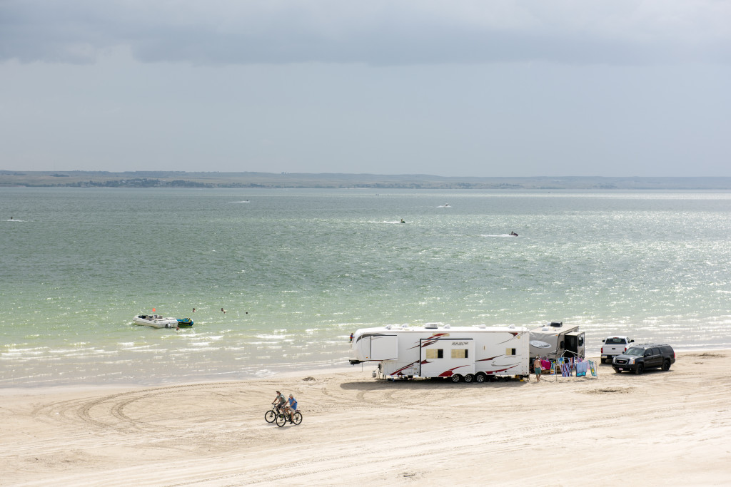 Rv campers, cyclists and water enthusiasts enjoy a day on Lake McCongaughy.