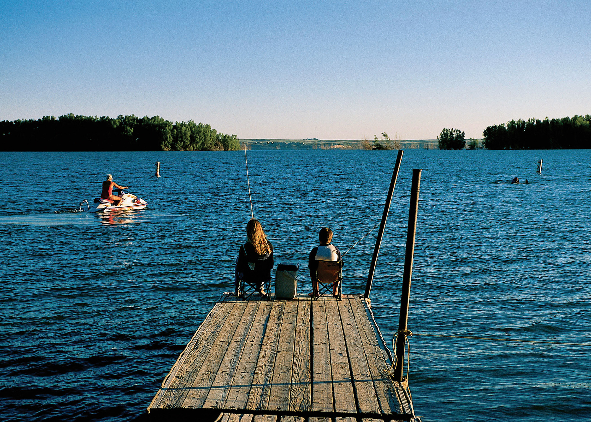 Fishing from a pier at Lake McConaughy State Recreation Area.