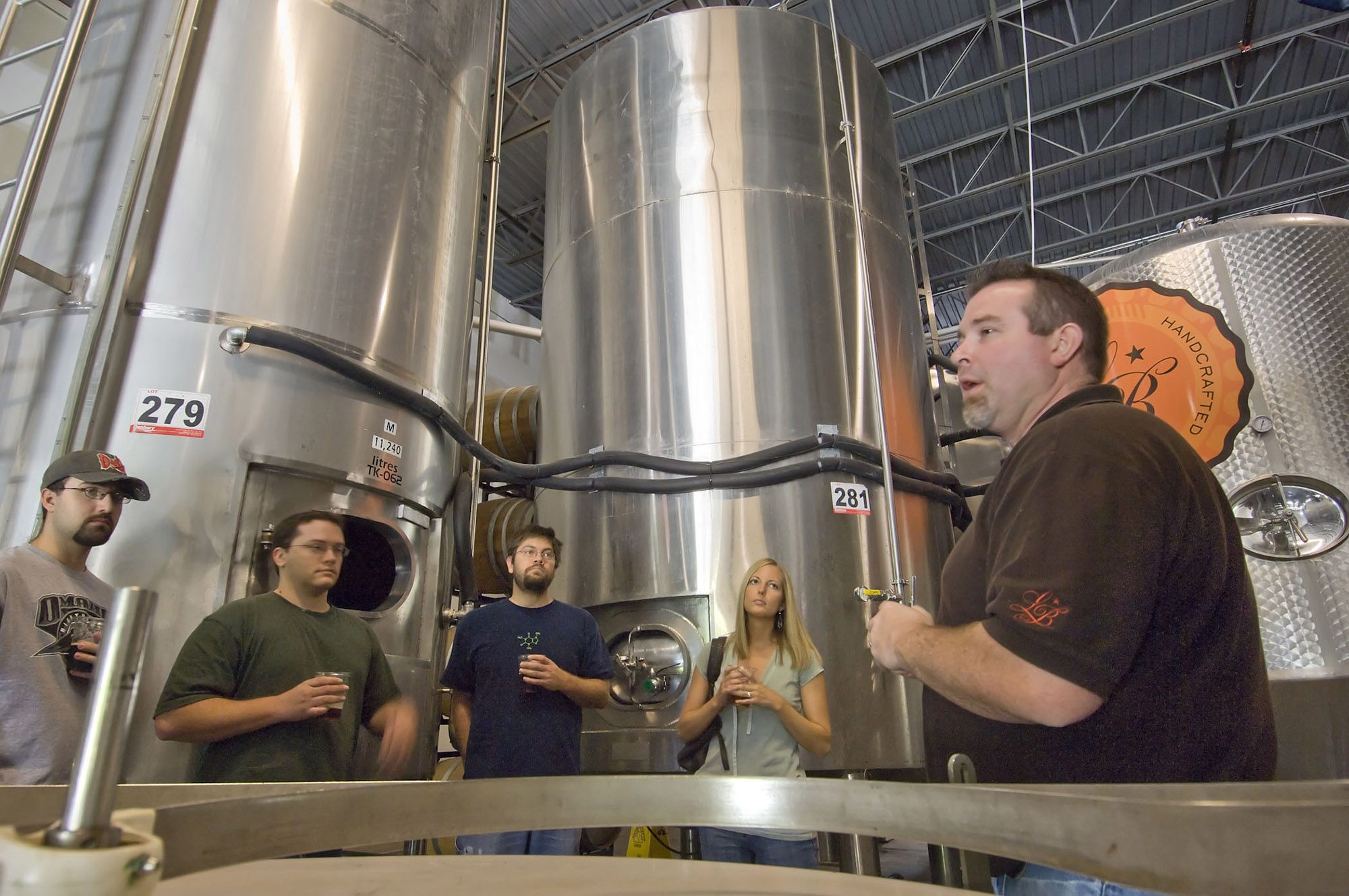 Guide leads a group on a tour of Lucky Bucket Brewing Company and Cut Spike Distillery. | Rick Neibel / Nebraska Tourism