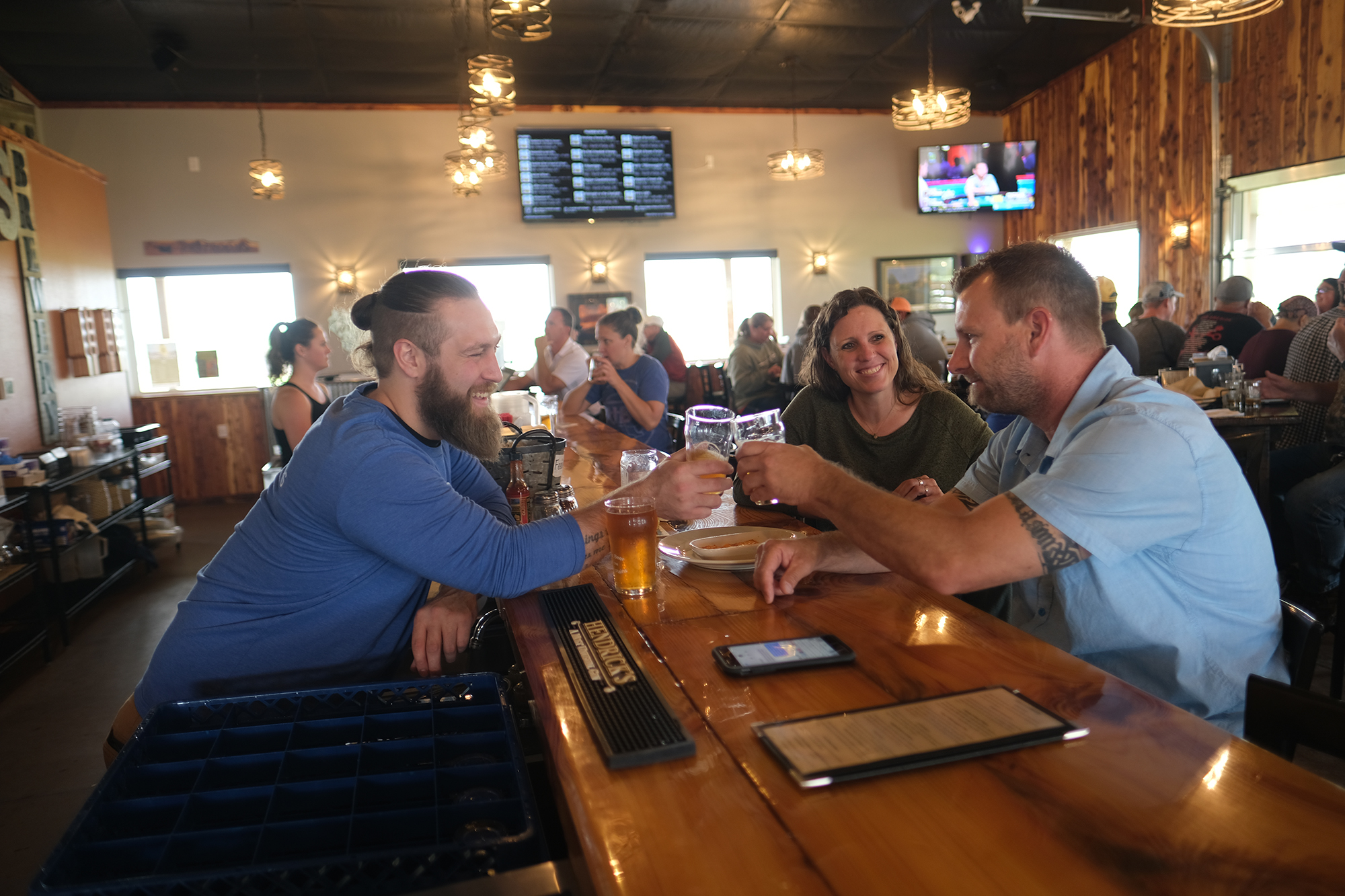 A group toasting at Pals Brewing Company.