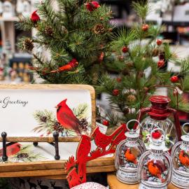 Holiday display in store with a Christmas tree and Cardinals surrounding.