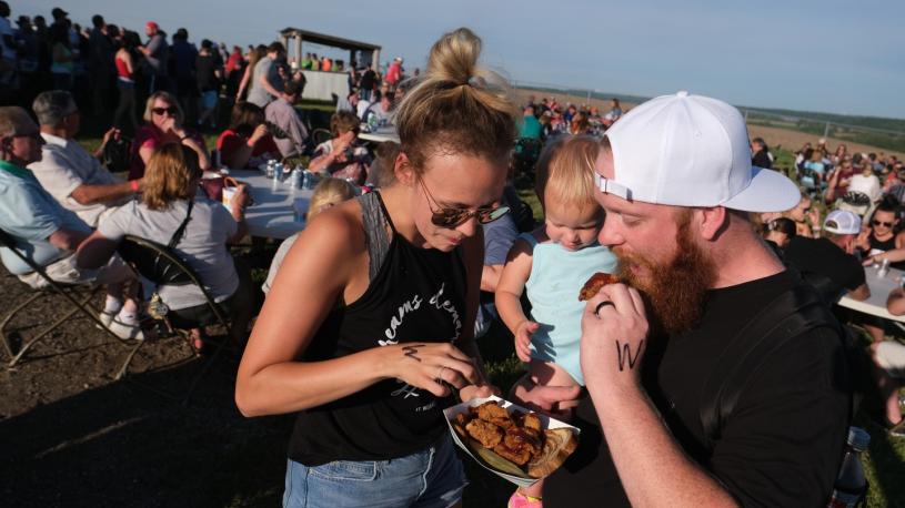 A family trying the beef fries at Round the Bend's annual Testicle Festival.