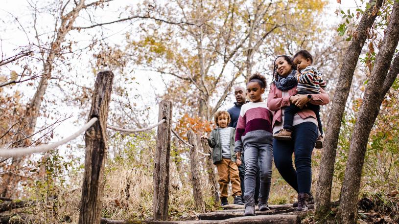 family walking around arbor day farm on spring day