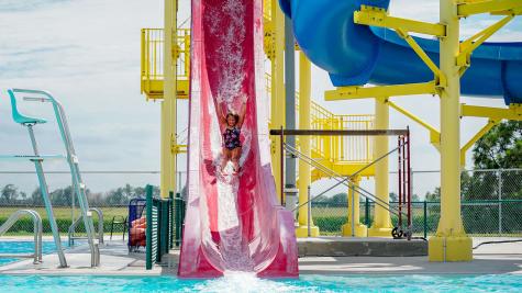 Child going down the water slide at Central City Aquatic Center.