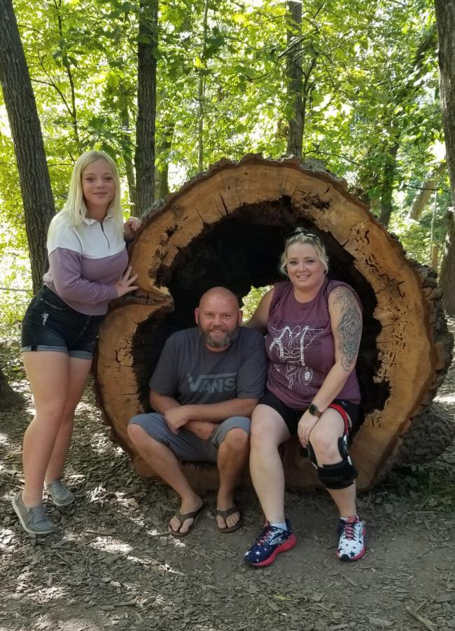 three people in tree