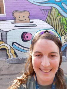 Girl in front of toaster mural