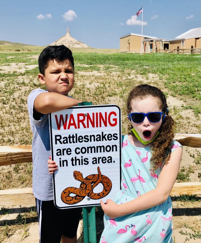 Kids with Rattle Snake sign