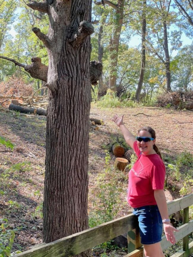 Girl next to tree